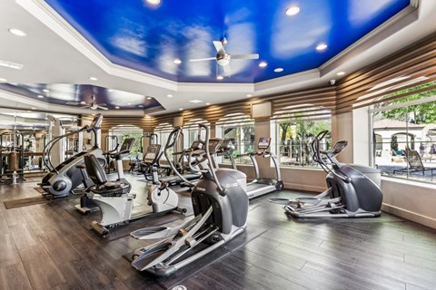 a gym with treadmills and other exercise equipment at Altezza High Desert, New Mexico