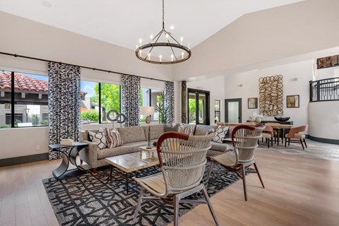 a living room with a couch and a table with chairs