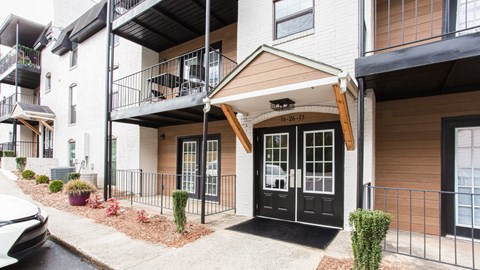 Apartment entrance with patio and balcony at Parkside Sandy Springs Atlanta, GA