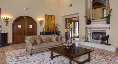 a living room with a couch and a fireplace