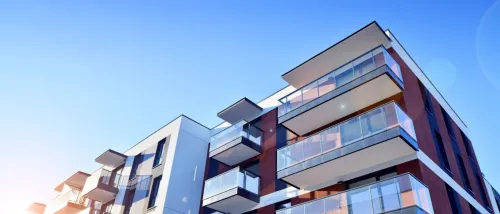 Modern apartment building on a sunny day. Facade of a modern apartment building.