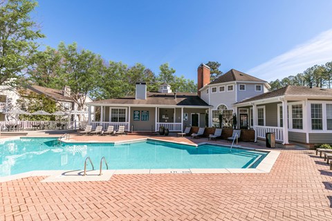 a large swimming pool with a house in the background at Briarcliff Apartments, Georgia