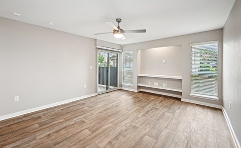 Bright and inviting living room area in the D5 floor plan at Windridge On The Parkway Apartments in Dallas, TX